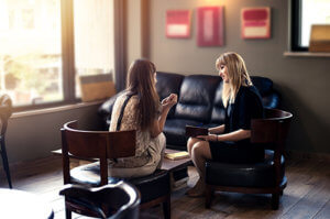 A woman participates in an individual counseling session at a drug rehab for women