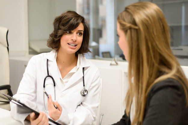 woman doctor discusses with a patient at a womens drug rehab program